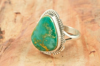 Genuine Manassa Turquoise set in Sterling Silver Ring. This Turquoise is also referred to as King�s Manassa Turquoise. The Manassa Turquoise mine is located in Manassa, Conejos County, Colorado. Created by Navajo Artist Larson Lee. Signed.